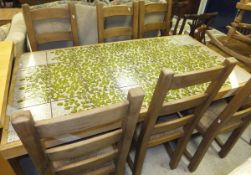 A tile top pine framed refectory style kitchen table,