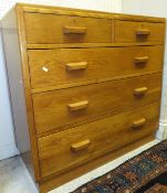 An early to mid 20th Century oak chest of two short and three long graduated drawers on plinth base,