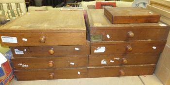 A collection of eight museum type pine collector's chests of drawers