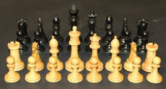 A Staunton style chess set, housed in an early 20th Century oak cigarette box with plated