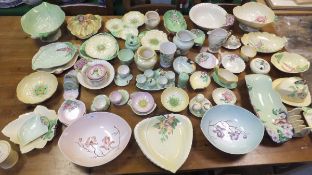 A large collection of Carlton ware leaf-moulded and flower-moulded table wares to include toast