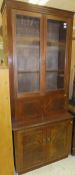 A mahogany secretaire bookcase with two glazed doors enclosing shelves,