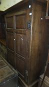 An oak hall cupboard in the 18th Century manner,