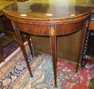 A 19th Century mahogany and inlaid demi-lune fold-over card table of small proportions, on square