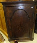 A circa 1800 oak hanging corner cupboard,