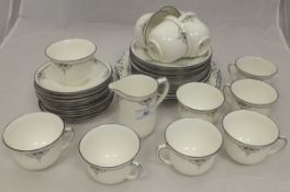 A collection of Shelley tea wares for twelve place settings to include cups and saucers, tea plates,