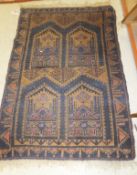 A Caucasian prayer rug in shades of pale terracotta, blue and taupe,