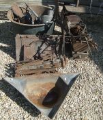 A collection of fourteen various cast iron gutter hoppers,