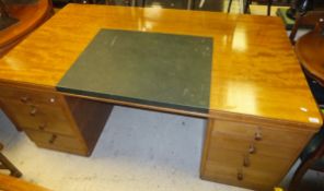 A 1950's Gimson & Slater mahogany double pedestal desk,