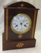 A mahogany and inlaid dome top mantel clock,