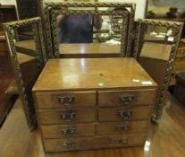 A small elm chest of six small drawers above a long drawer and a gilt decorated three fold dressing