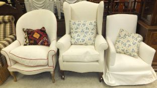 An early 20th Century wing back armchair,