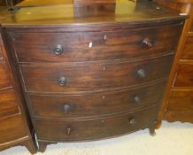 A Victorian mahogany bow fronted chest of four long graduated drawers on splayed bracket feet