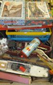 Two boxes containing a quantity of vintage toys and games to include a model steam ship,