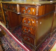 A reproduction mahogany pedestal desk,