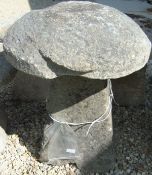 A natural stone staddlestone with sides cut as four facets CONDITION REPORTS Approx 78cm high total.