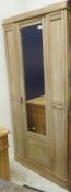 A circa 1900 satin walnut single mirror door wardrobe,