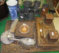 A collection of four pewter mugs, a coppered tankard, a Spanish embossed leather blotter,