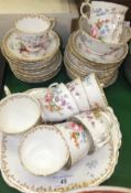 A collection of Crown Staffordshire "England's Bouquet" pattern tea wares to include cups and