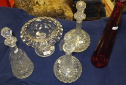 Two onion shaped cut glass decanters, a mallet shaped cut glass decanter,