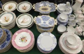 An early 20th Century Worcester part dessert service decorated with ferns and wild flowers to