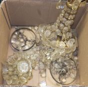 A box containing a collection of cut glass hanging lustres