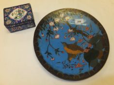 A cloisonné dish depicting a pair of birds within prunus decorated landscape and an enamel