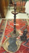 A turned wood table lamp base in the form of a pricket candlestick,