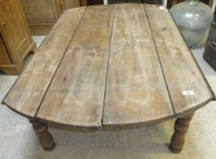 A fruitwood drop-leaf kitchen table on turned and ringed supports (cut down to coffee table size)