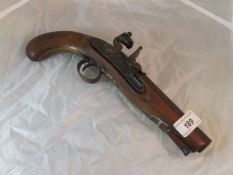 A 19th Century walnut handled flintlock pistol with proof marks to barrel stamped ".... ST & Sons"