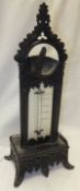 A Victorian patinated metal pocket watch stand / barometer with Gothic arch and pilaster decoration