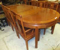 A modern Chinese hardwood extending dining table, a set of eight chairs (seven plus one),