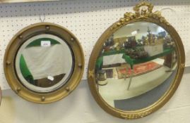 Two circular gilt framed wall mirrors