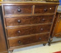 A Victorian mahogany chest of two short and three long graduated drawers on turned feet