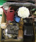 A bronze effect figure of a lion with paw on ball, assorted modern tea caddies, watering cans,