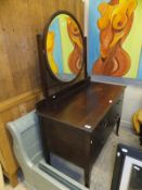 A mahogany dressing table of two short and one long drawer,