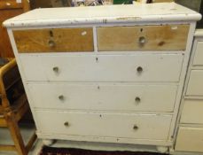 A painted pine chest of two short and three long drawers,