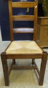 A set of ten oak rush seated ladder back dining chairs