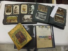 Two early 20th Century postcard albums containing assorted topographical postcards,