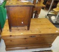 A pine blanket box with wrought iron handles, raised on a plinth base, together with a sewing box,