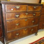 An 18th Century walnut chest,