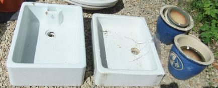 Two Belfast sinks and six assorted garden pots