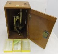 A 19th Century brass monocular microscope by Baker of 244 High Holborn Street, London,