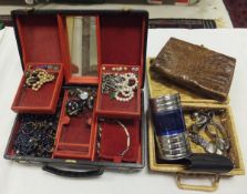 A Finnegan's leather covered jewellery case and contents of various costume jewellery together with