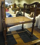 A circa 1900 French carved beech framed and caned stool in the Louis XVI taste