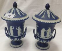 A pair of Wedgwood dark blue Jasperware campana vases and covers CONDITION REPORTS Both vases with