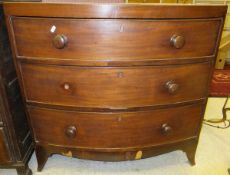 A 19th Century mahogany bow fronted chest of three long graduated drawers on splayed bracket feet