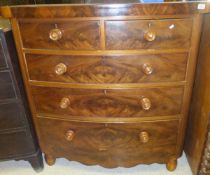 A Victorian mahogany bow fronted chest of two short and three long graduated drawers over a shaped