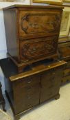 A 19th Century mahogany commode with applied decoration and brass handles,