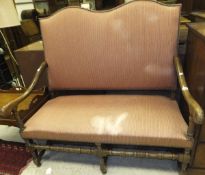 An early to mid 20th Century stained beech framed two seat settee in the William and Mary manner